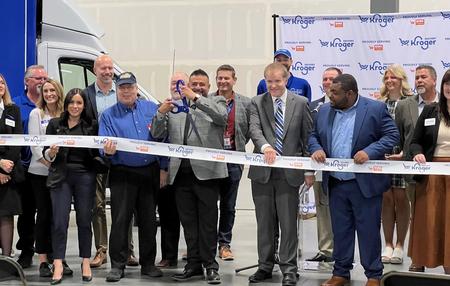 Johnstown Economic Development Manager Sarah Crosthwaite and Mayor Troy Mellon pose with representatives from Kroger and other regional partners at a ribbon cutting ceremony at the company's new fulfillment facility in Johnstown on September 21st, 2023. 